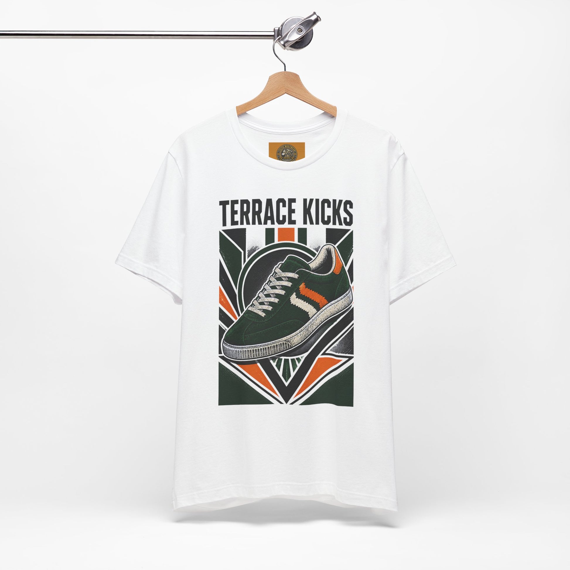 White graphic sneaker tee with “Terrace Kicks” shoe print, hanging on a wooden hanger