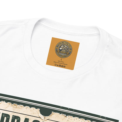 White T-shirt close-up: small square emblem and partial ticket graphic at chest