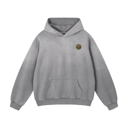 Light gray oversized hoodie with hood, front pouch pocket, and small chest logo patch