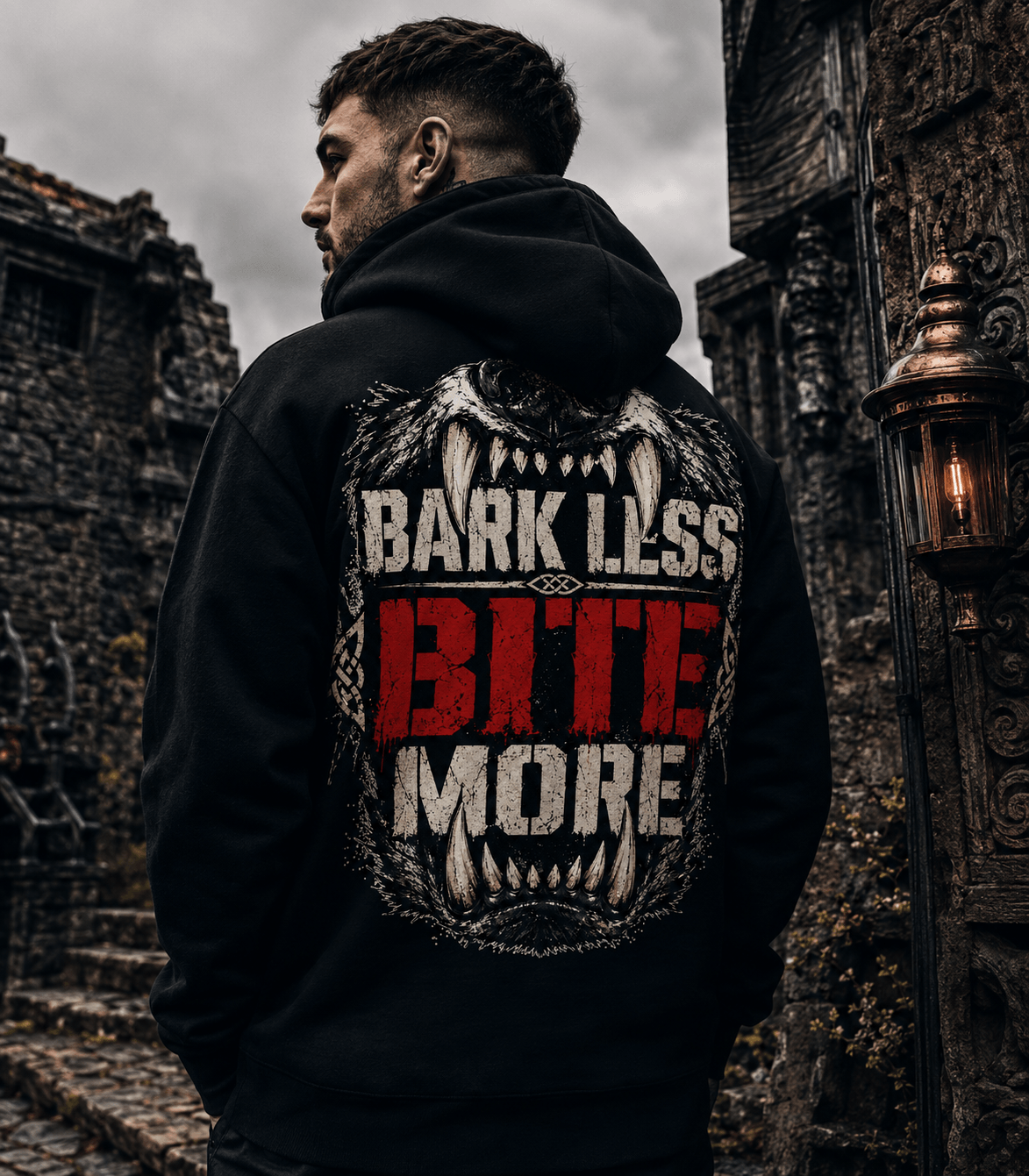 Model wearing an Irish heritage Celtic Wolfwear hoodie in a dark urban setting
