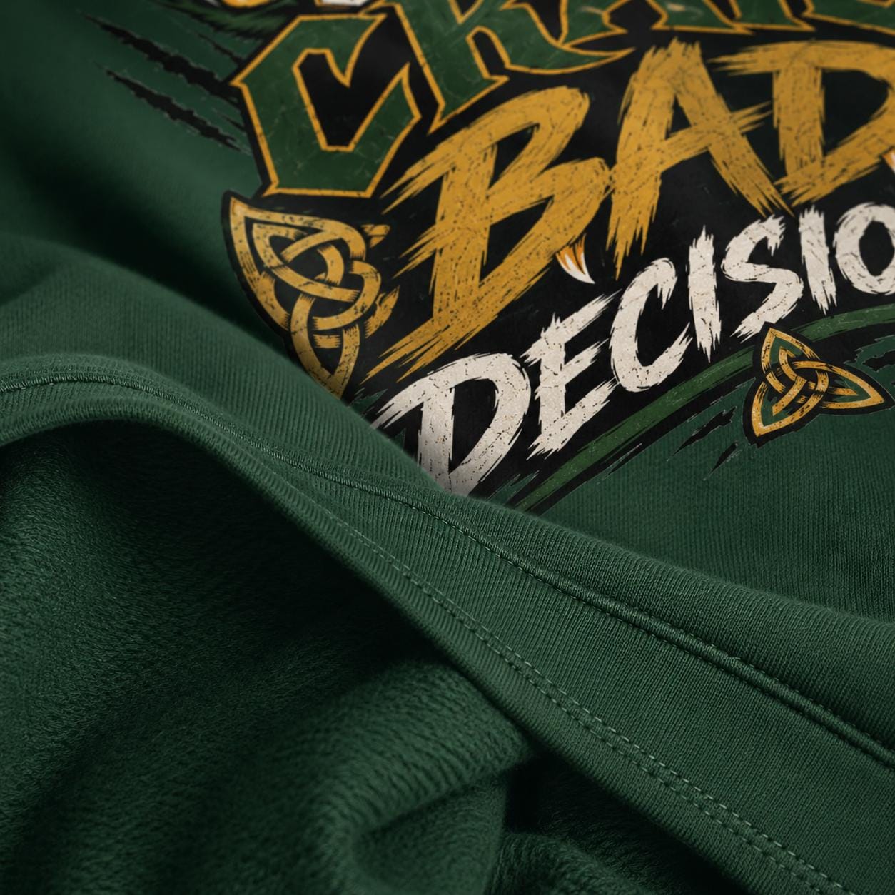 Forest green hoodie close-up of “Good Craic Bad Decisions” printed graphic