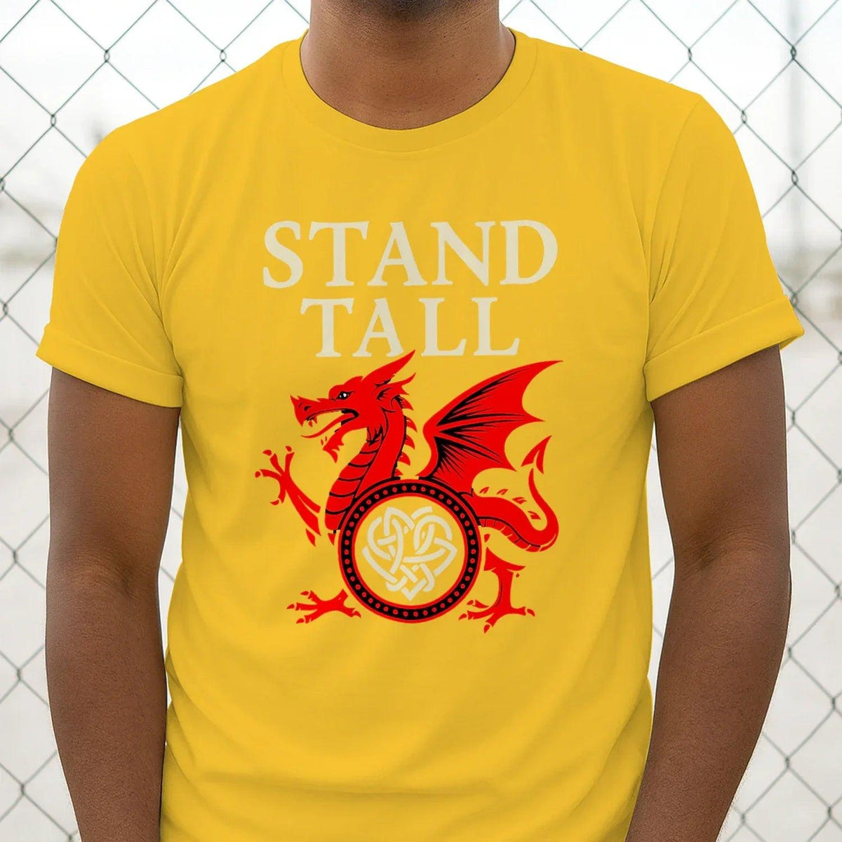 Yellow crew-neck T-shirt with 'STAND TALL' lettering and red dragon emblem graphic