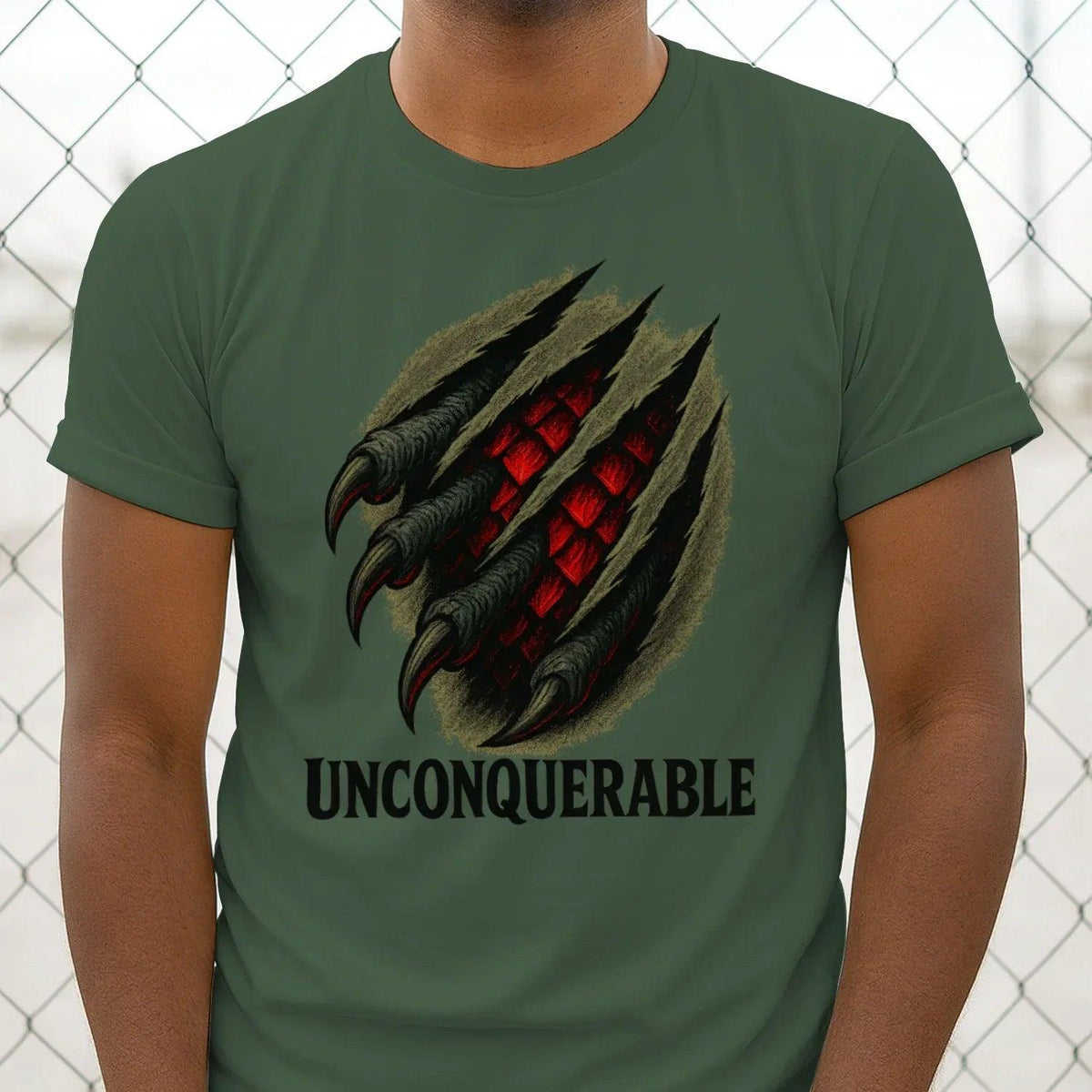 Green cotton T-shirt front view with dragon claw graphic and 'UNCONQUERABLE' lettering