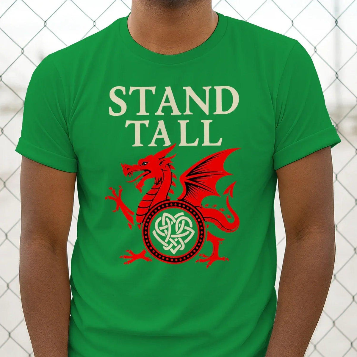 Green crew-neck T-shirt with Stand Tall lettering and red dragon emblem