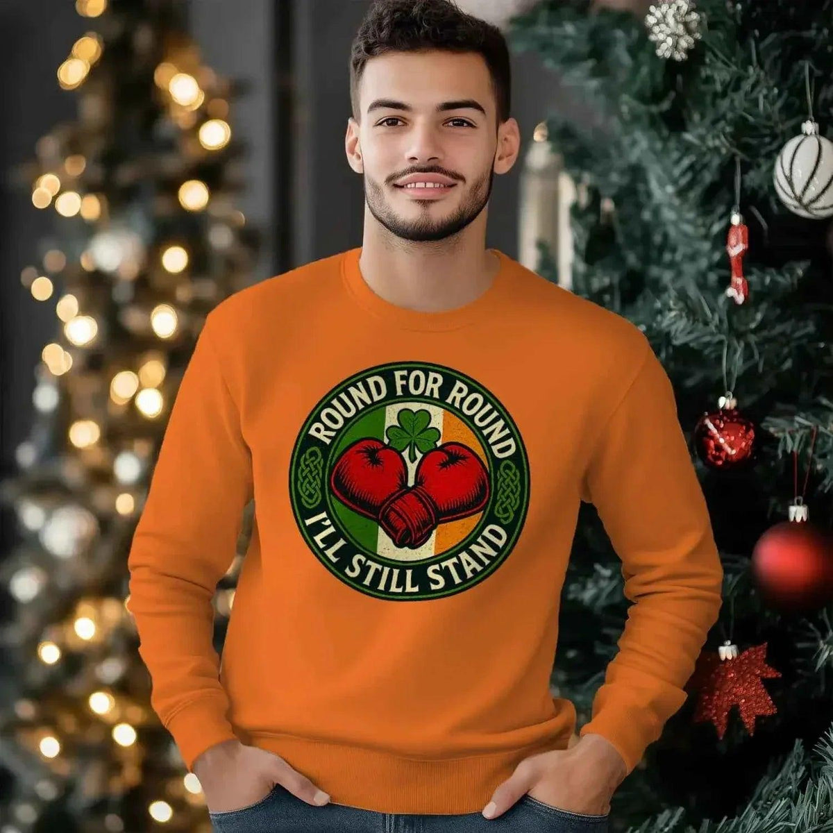 Orange crewneck cotton sweatshirt with circular heart-and-clover graphic on front