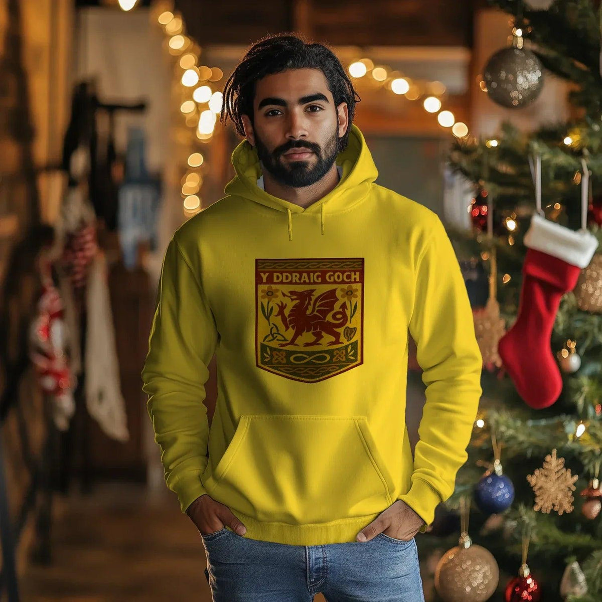 Yellow Welsh dragon hoodie on model with front emblem, kangaroo pocket and hood