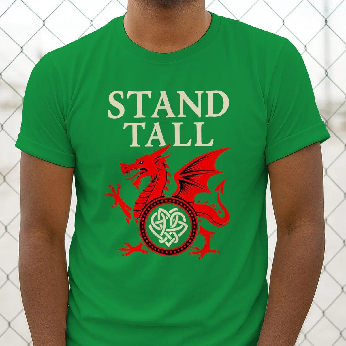 Green T-shirt with "STAND TALL" text and red dragon emblem graphic on the front