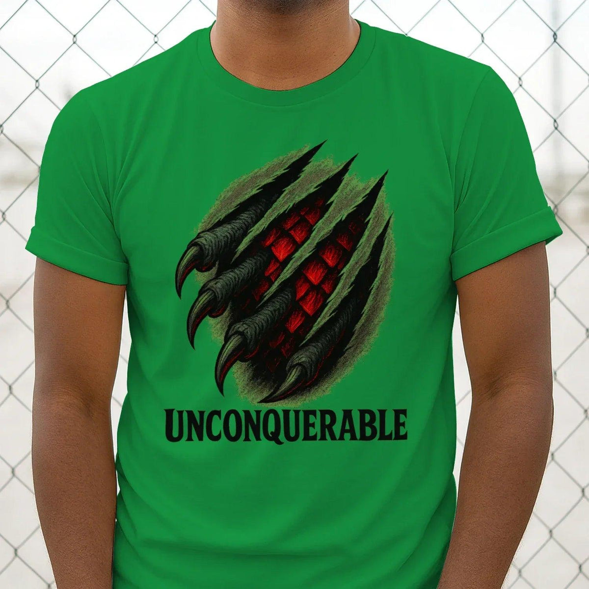 Green cotton T-shirt with black dragon claw graphic and UNCONQUERABLE lettering