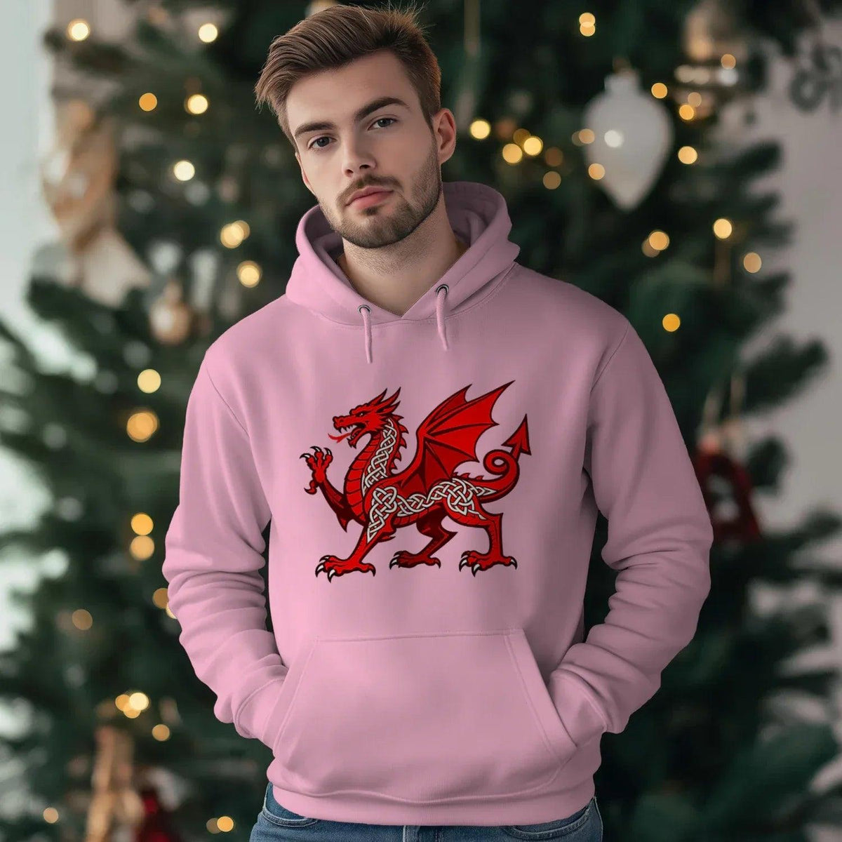 Baby pink hoodie with red dragon crest on the chest, front pouch pocket, and drawstring hood