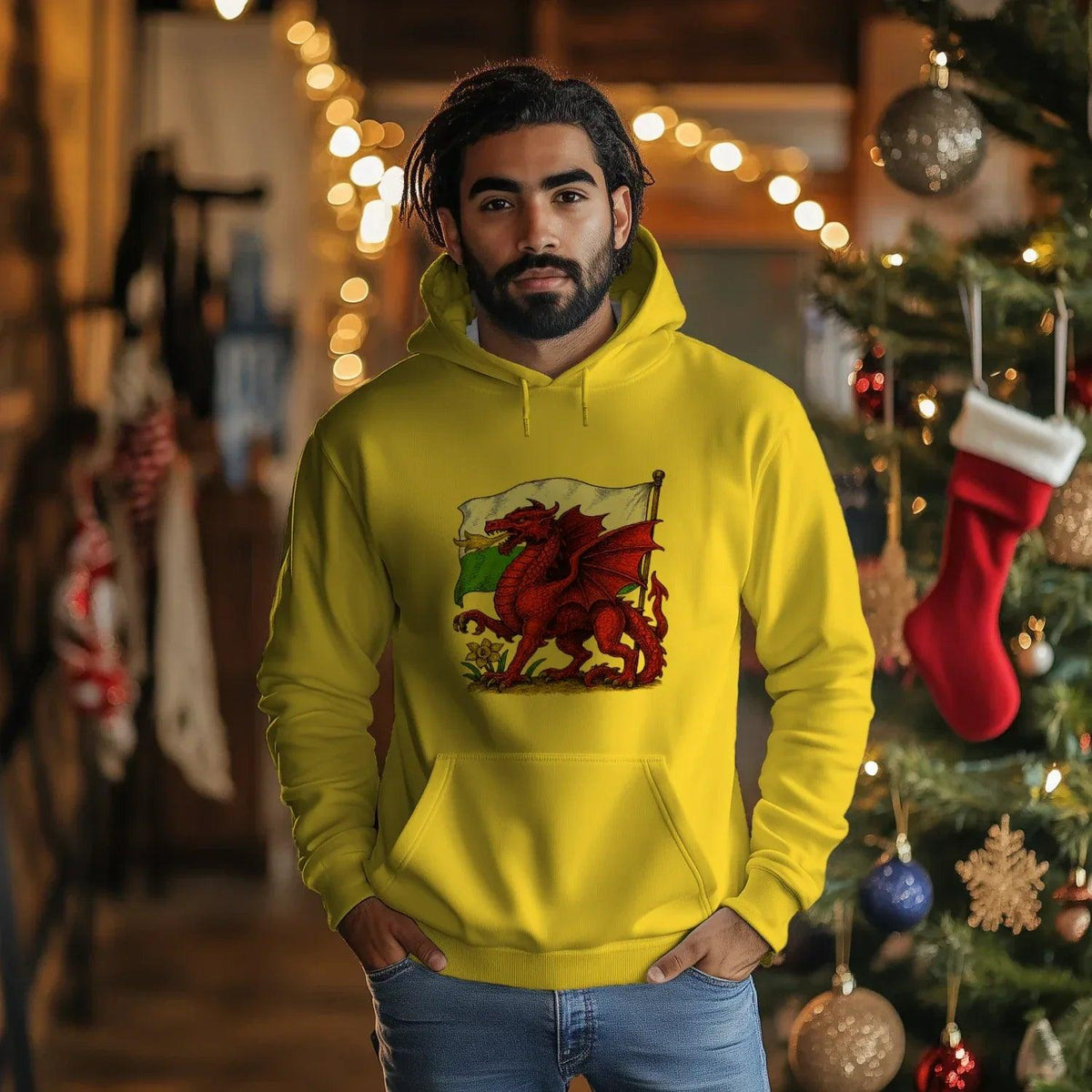 Mustard yellow hoodie with front pocket, drawstring hood, and Welsh dragon flag chest graphic