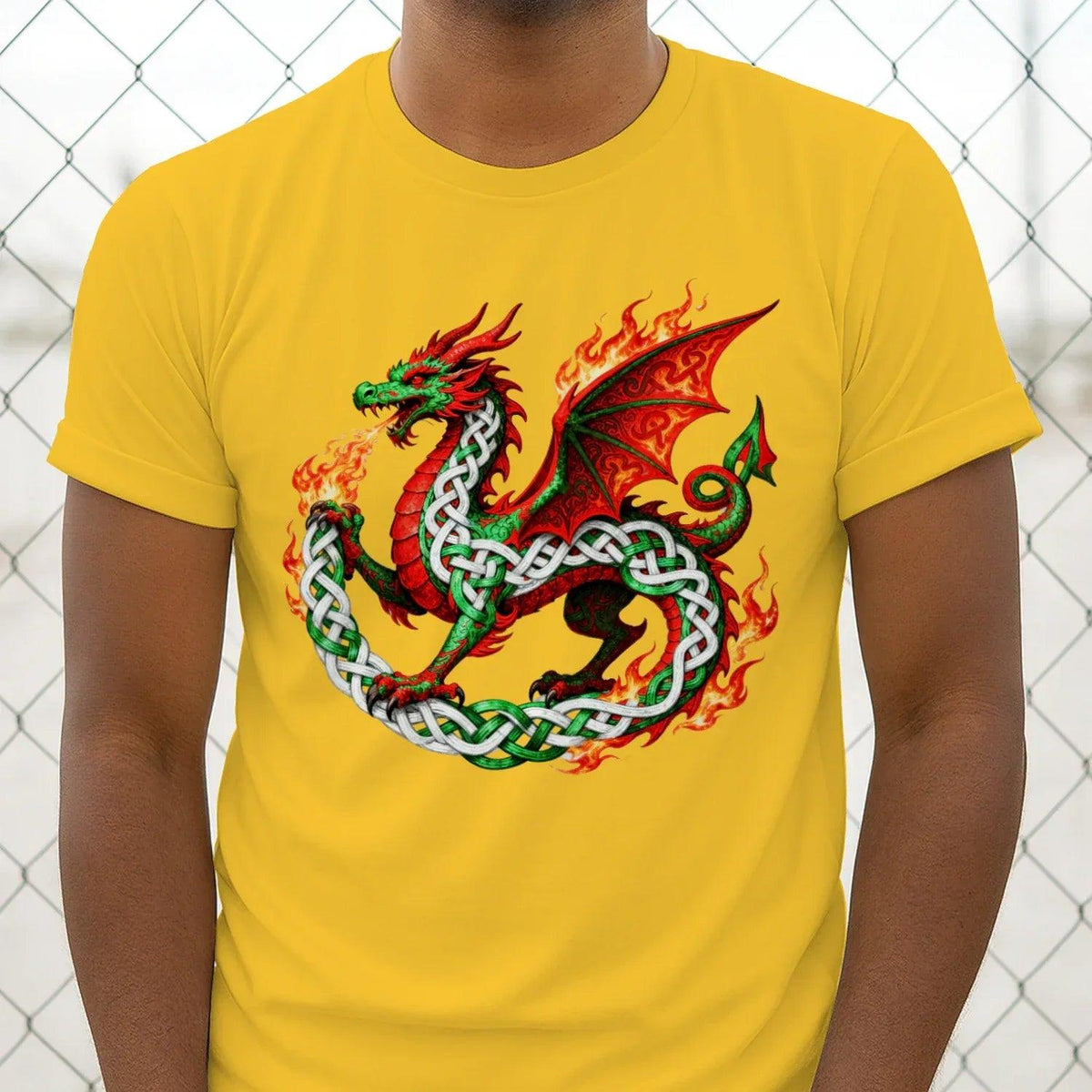 Yellow Welsh t-shirt featuring a centered dragon, flame accents, and green-white knot pattern