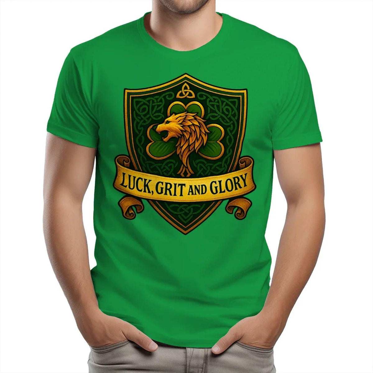 Green heavy T-shirt with large lion crest artwork and banner text 'LUCK, GRIT AND GLORY'.