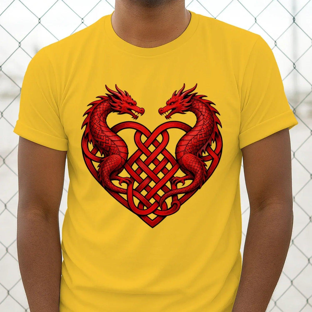 Yellow T-shirt front view with red dragon heart graphic and Celtic knot detailing