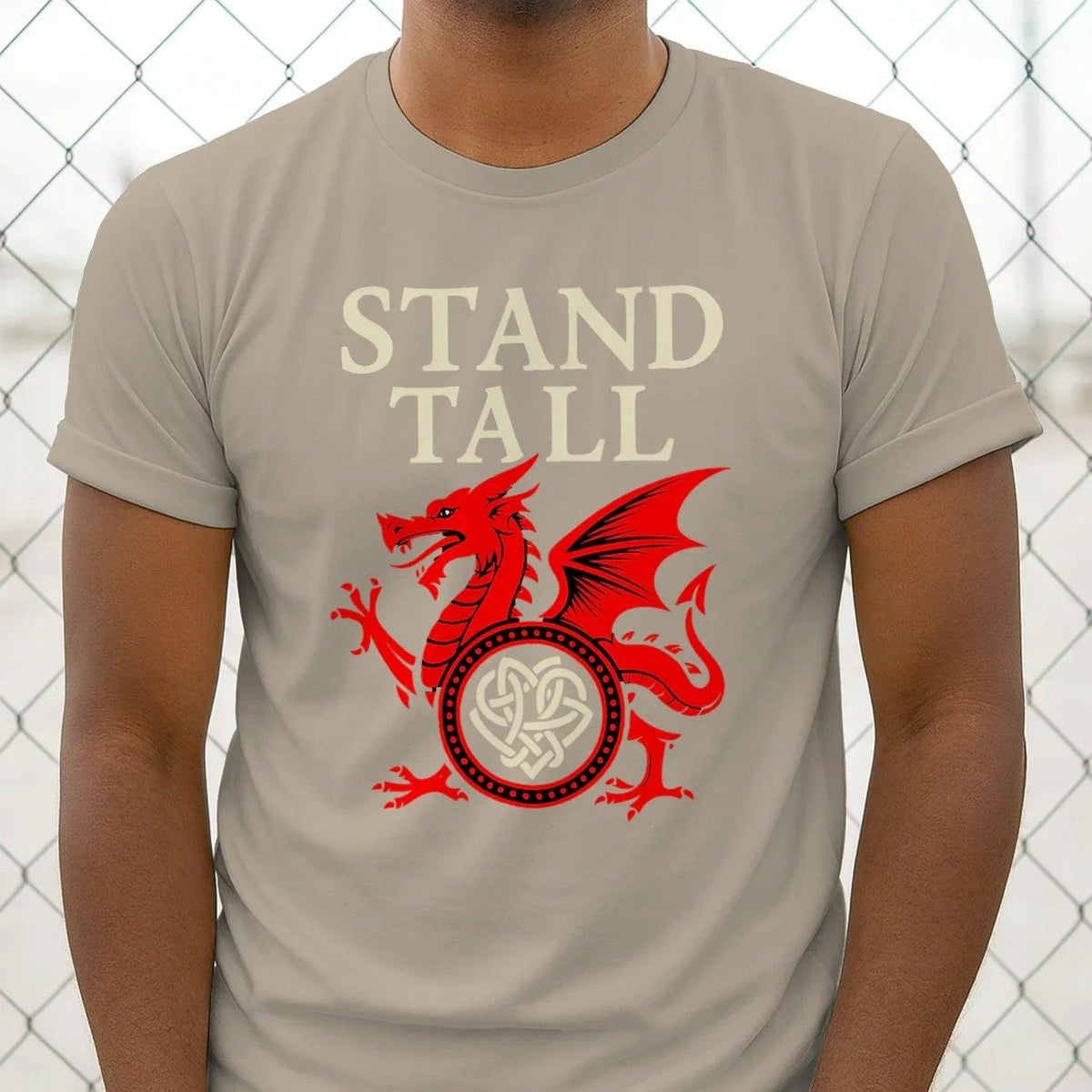 Sand T-shirt with "STAND TALL" text and red dragon emblem graphic centered on chest