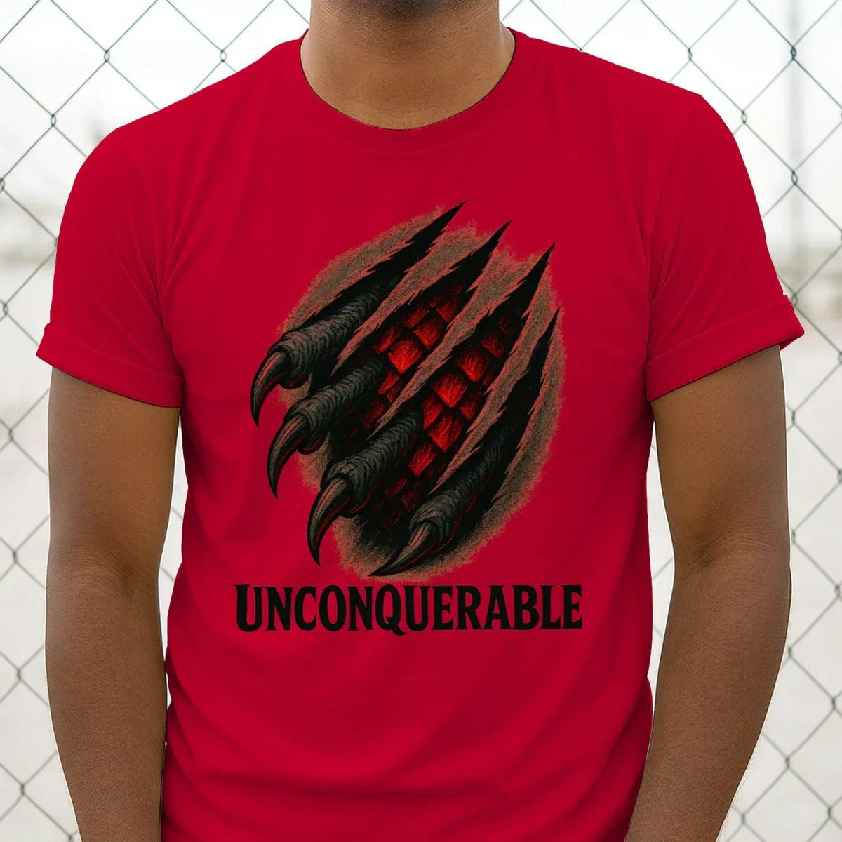 Red cotton T-shirt with large dragon claw graphic and 'UNCONQUERABLE' lettering