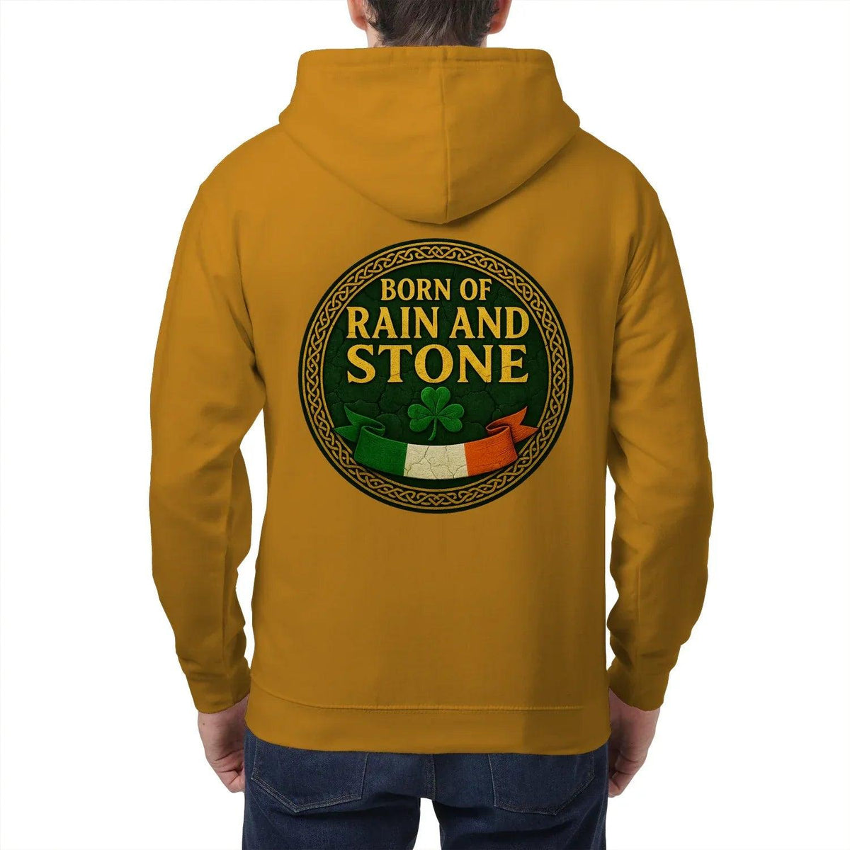 Mustard zip hoodie with hood, back round logo reading “Born of Rain and Stone”
